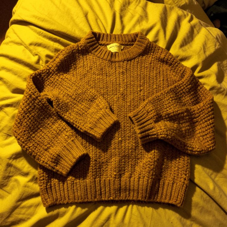 Sweater flat-lay + model wearing it — reference 1