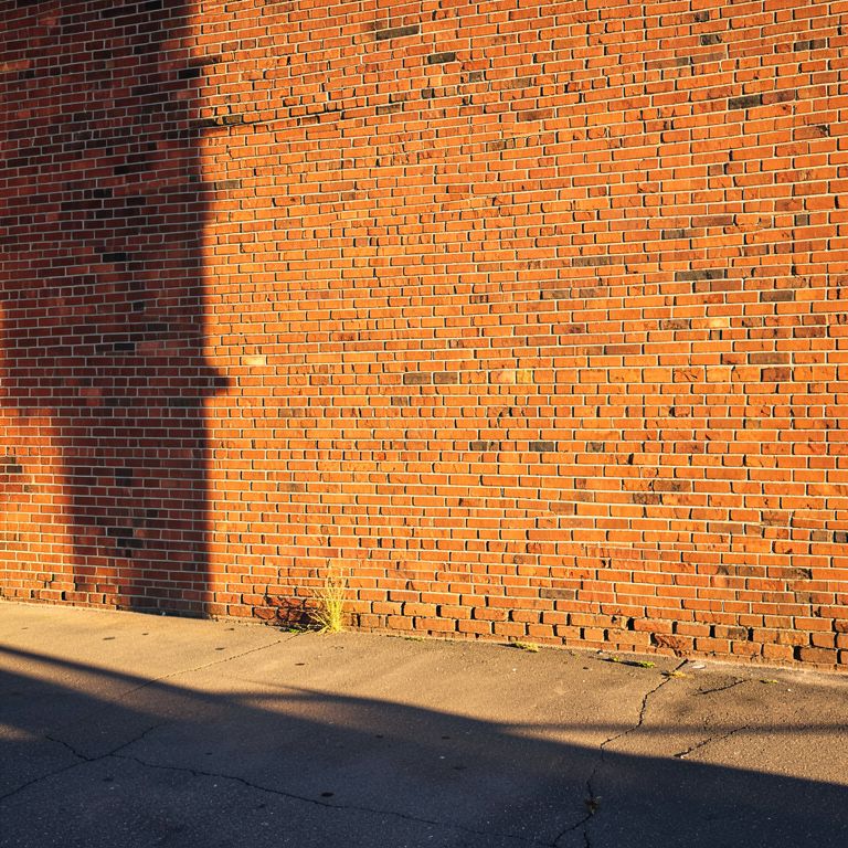 Sneakers + skateboard prop + street backdrop — reference 3
